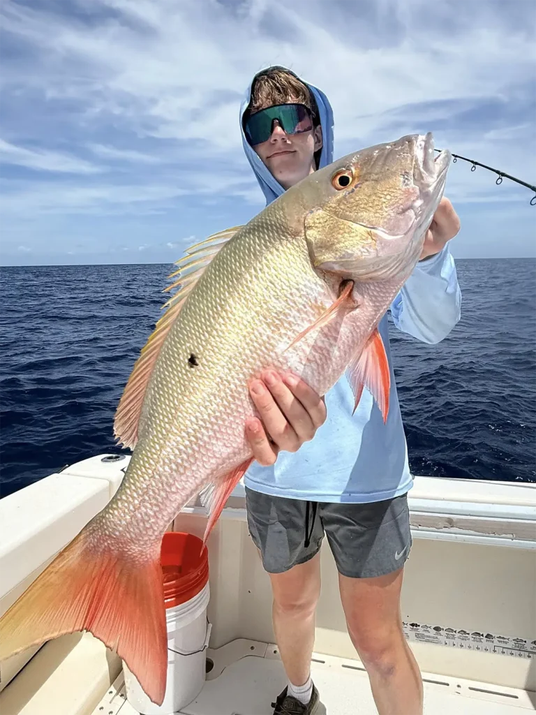 Angler holding a large snapper offshore near Marathon Florida Keys