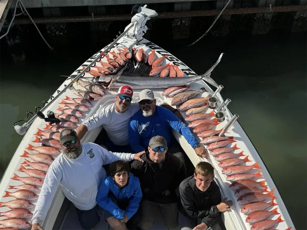 Group of anglers with a large haul of red snapper on a FishHawk Charters boat in St Petersburg