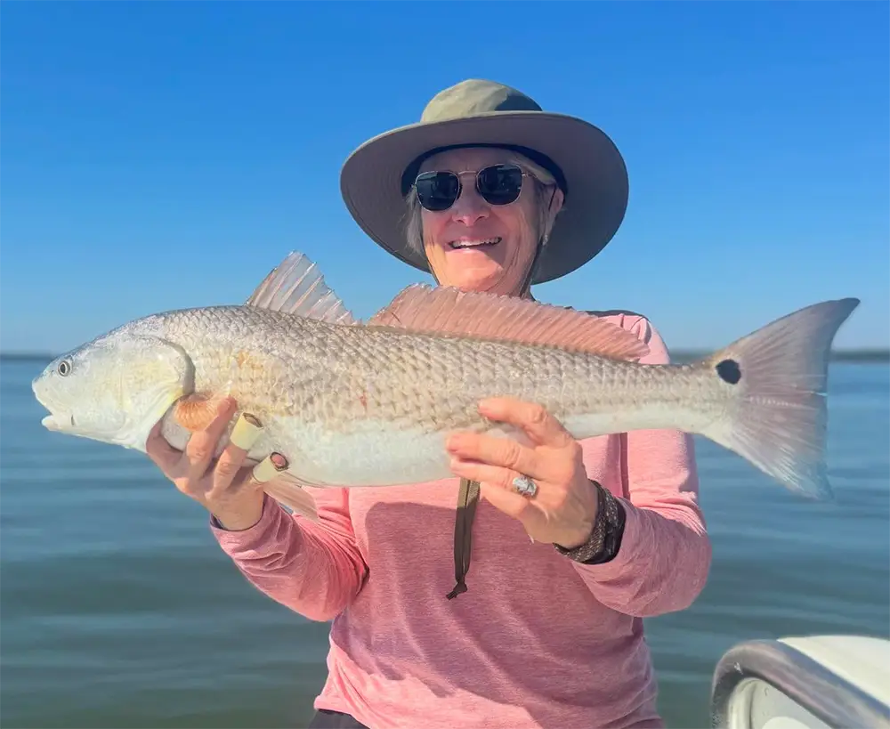 Redfish being held on a calm November day in Hilton Head SC during a charter trip